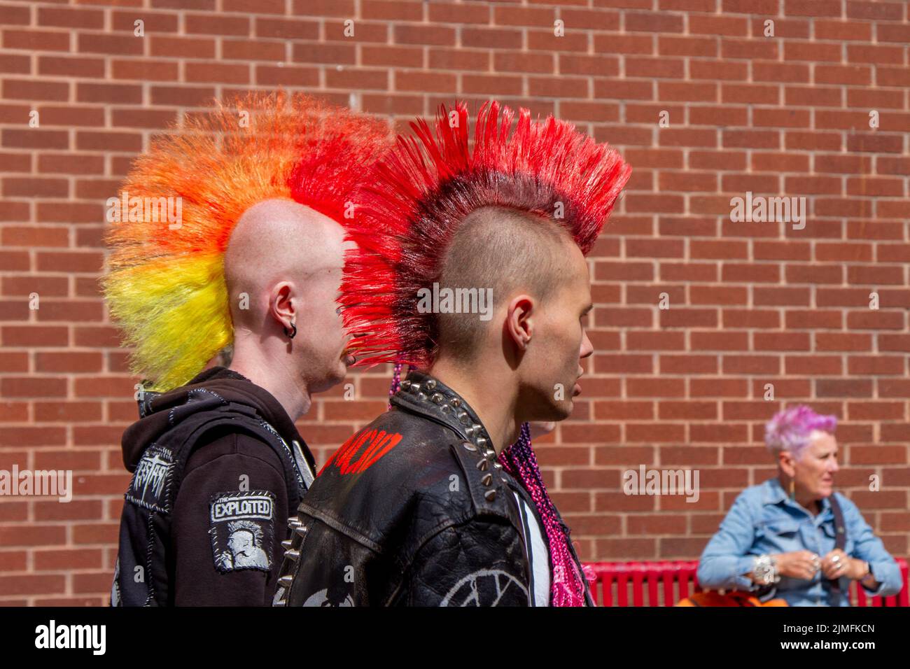 Dyed mohican liberty spikes hair in Blackpool, Lancashire, UK. Aug 2022. The punk subculture, ideologies, fashion, with Mohican dyed hairstyles and colouring at the Punk Rebellion festival at The Winter Gardens. A protest against conventional attitudes and behaviour, a clash of anti-establishment cultures,  mohawks, safety pins and a load of attitude at the seaside town as punks attending the annual Rebellion rock music festival at the Winter Gardens come shoulder to shoulder with traditional holidaymakers. Stock Photo