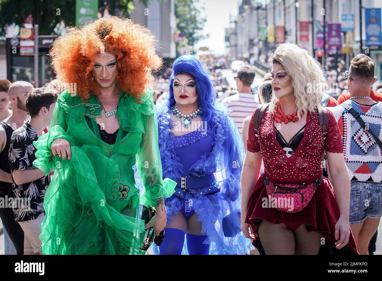 East Sussex, UK. 6th August 2022. Brighton and Hove Pride 2022. Three performing Drag Queens walk through the city centre. Thousands attend the annual LGBT+ celebration march from Hove Lawns to Preston Park. Credit: Guy Corbishley/Alamy Live News Stock Photo