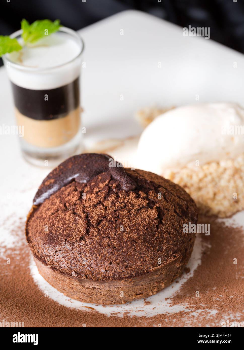 Molten chocolate cake with peanut butter shooter. Stock Photo
