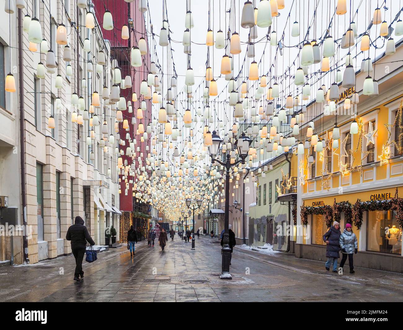 Stoleshnikov lane decorated with numerous Christmas lanterns on a winter day. Stock Photo