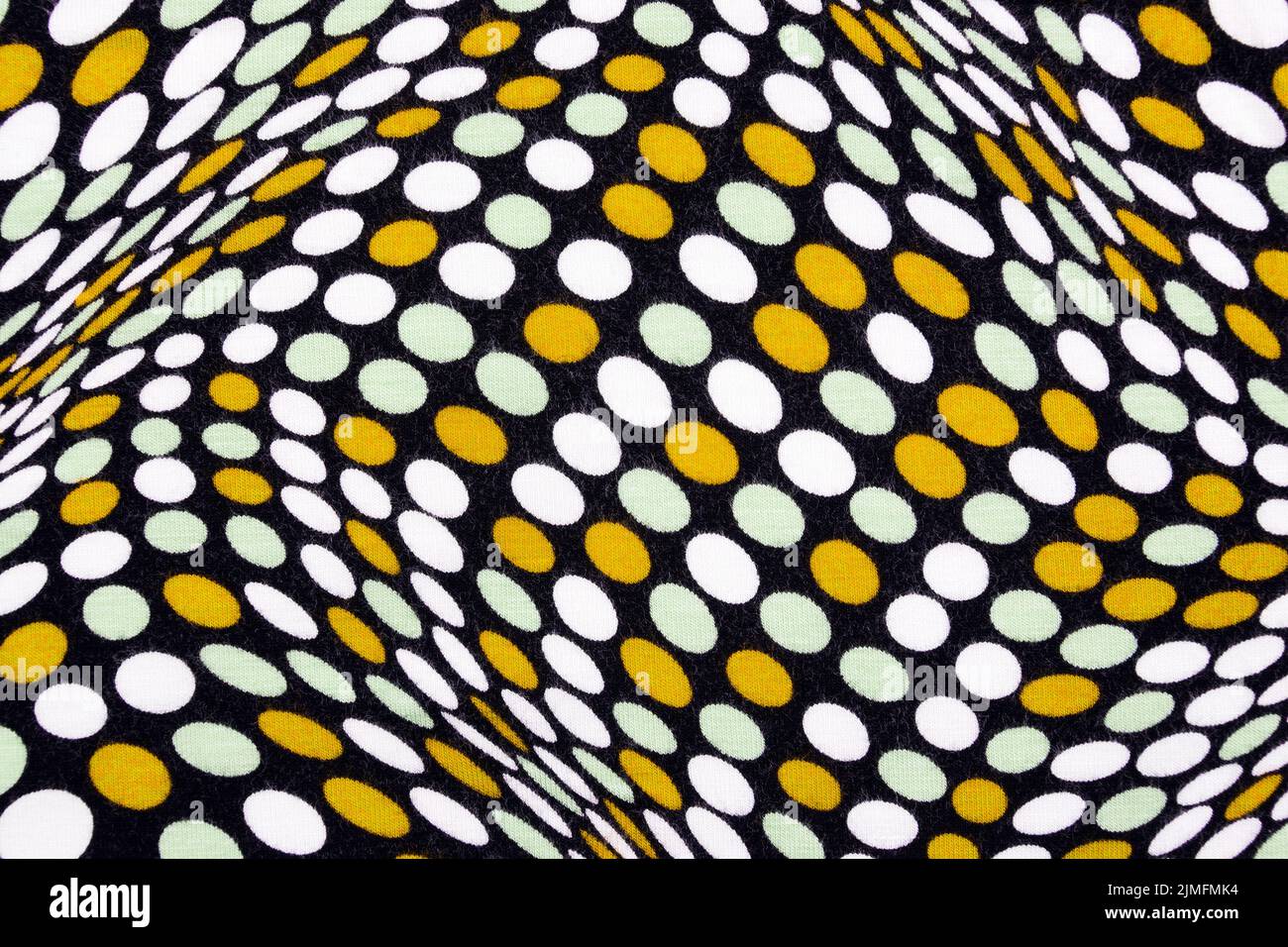 White material in yellow and white dots, a background or texture Stock Photo