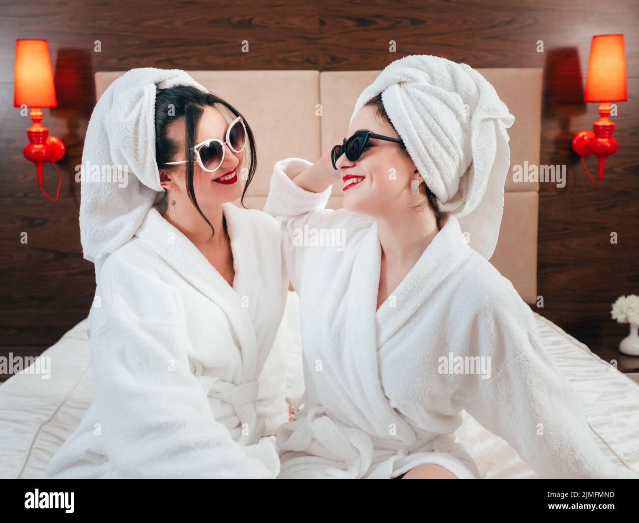 bff spa beauty care females bathrobes smiling Stock Photo