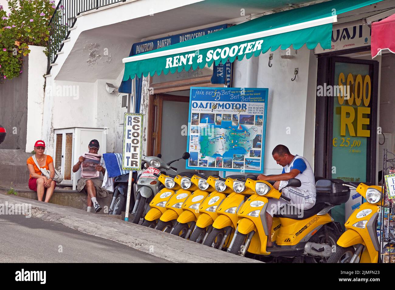 Motor scooter rental the harbour promenade of Marina Grande, Capri island, Gulf of Naples, Italy, Sea, Europe Stock Photo