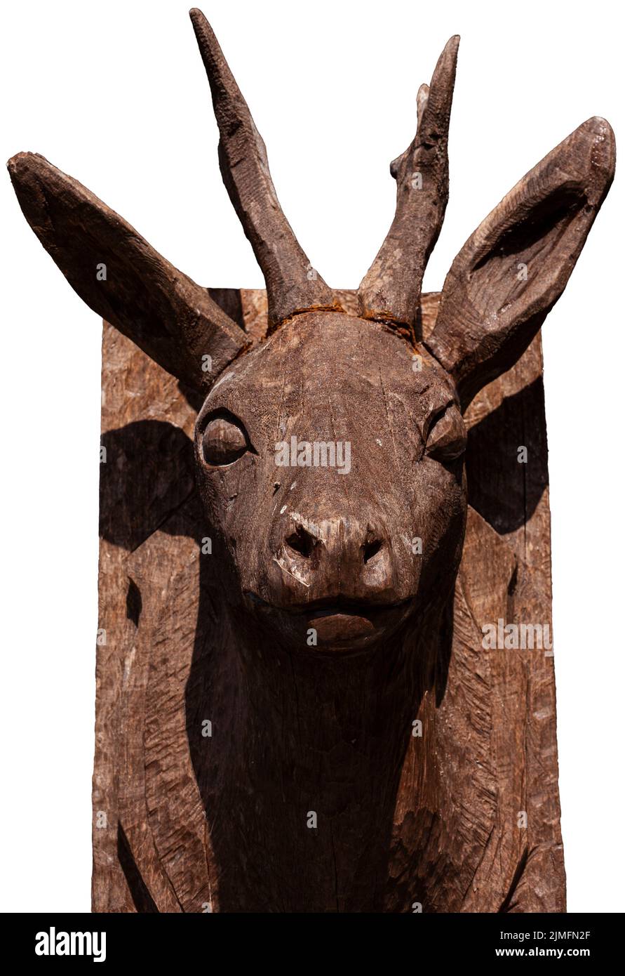 Head of a deer made from wood isolated on white background Stock Photo