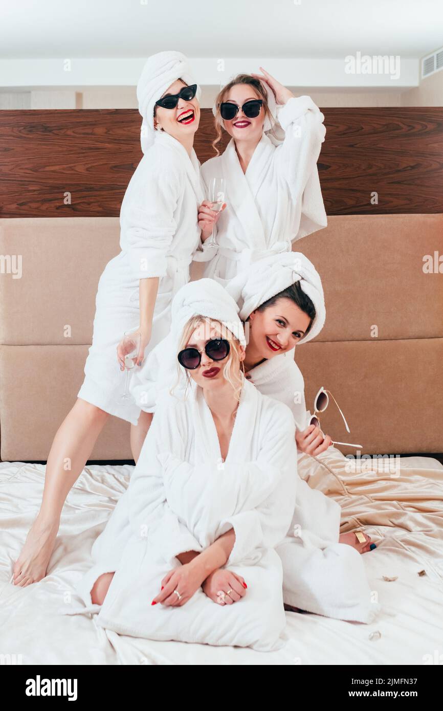 girls hangout leisure joy women posing bathrobes Stock Photo