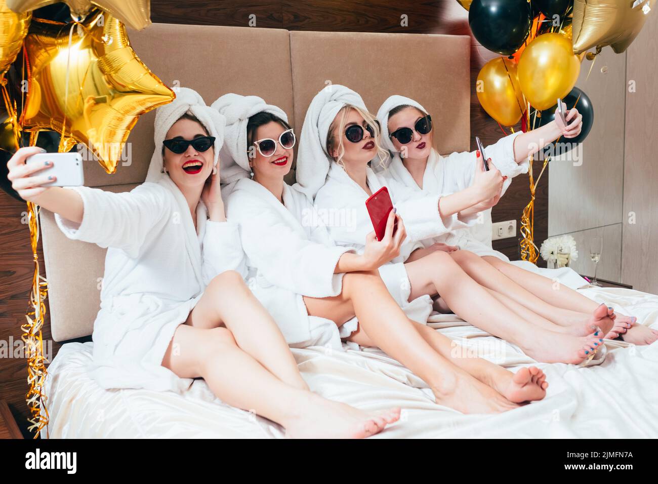 bathrobe party girls selfie leisure lifestyle Stock Photo