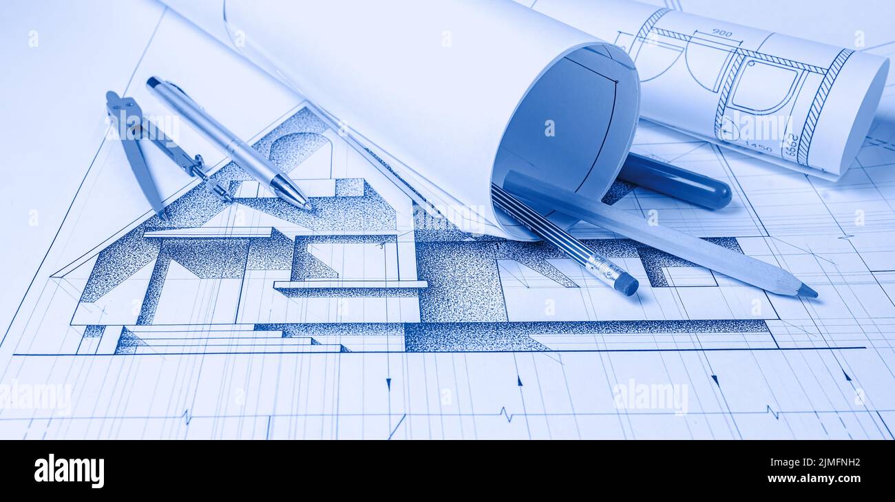 Rolls of architecture blueprints and house plans Stock Photo