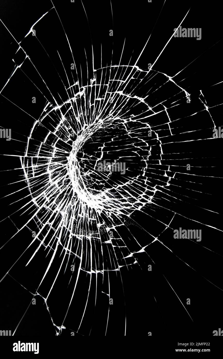Crack on a broken glass mirror on a white background line of fragments