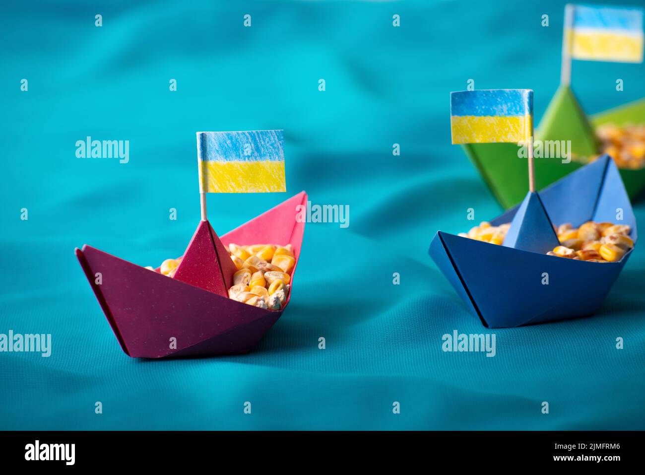 Ships with Ukrainian maize grain made of paper concept Stock Photo