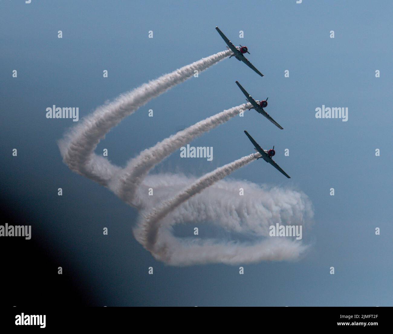 Three of the Skytypers acrobatic airplane performance team perfoming at