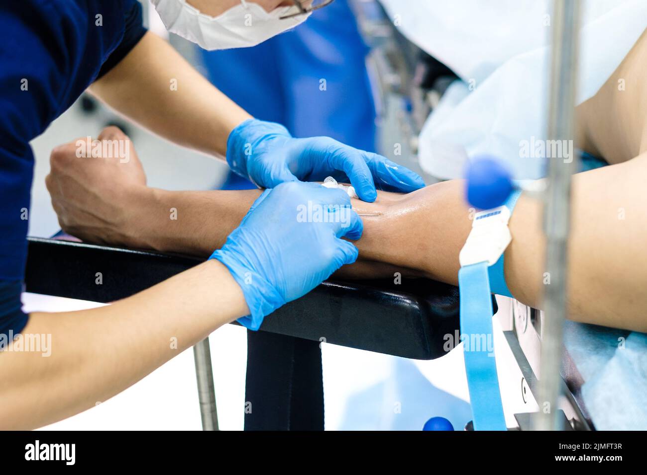 Intravenous administration of medications during surgery Stock Photo