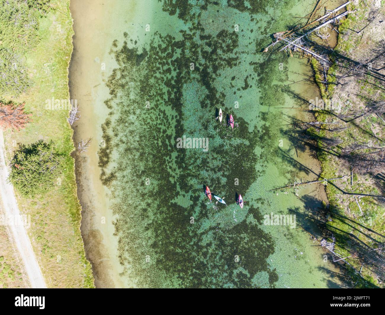 Group of people kayaking Spring Creek, a cristal clear river in Southern Oregon Stock Photo