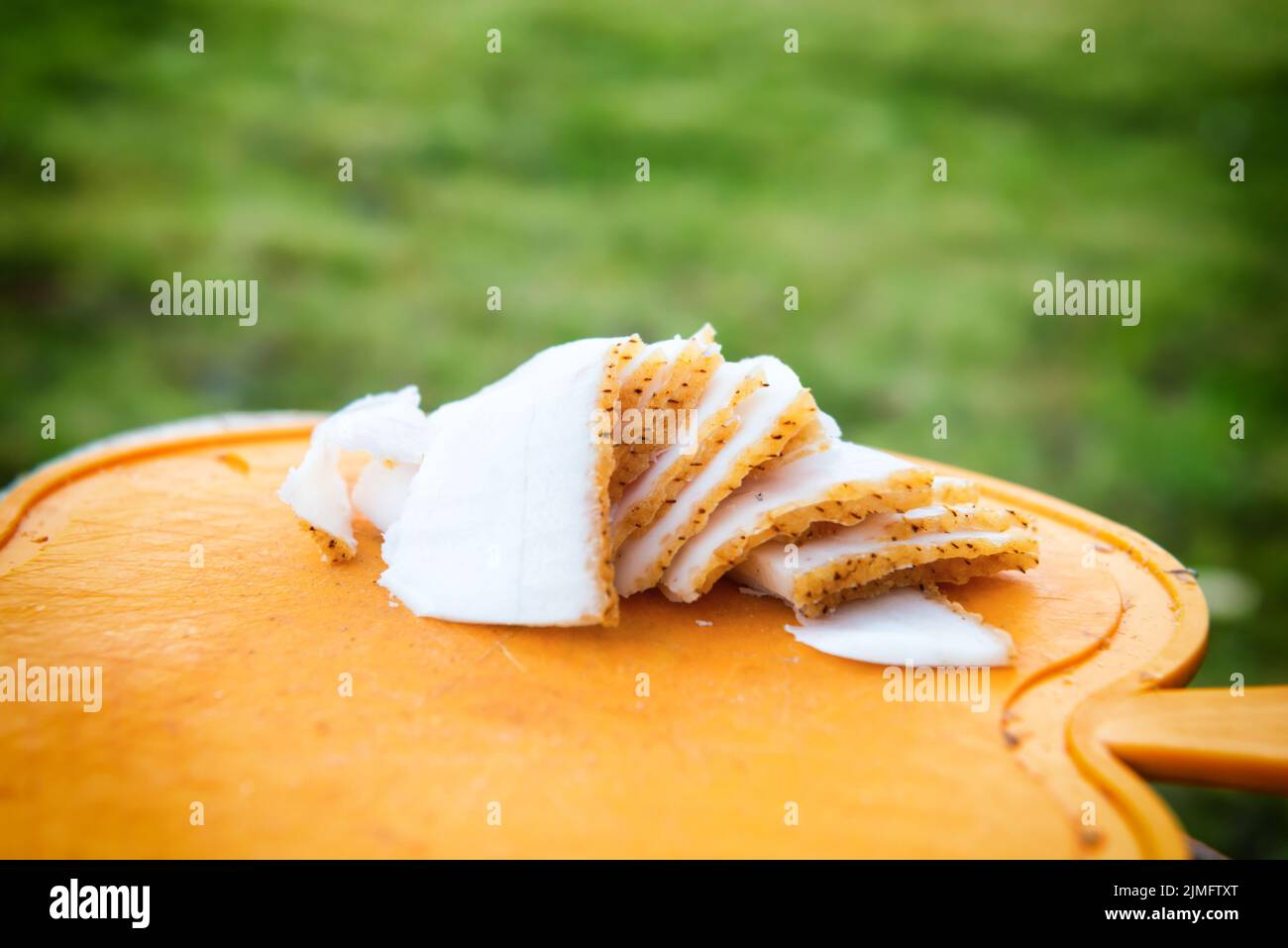 Slices of pig fat on board Stock Photo
