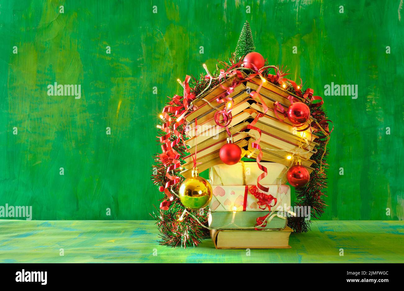 Giving books for christmas, christmas decoration and  gift wrapped books.Reading,literature,education,gift,present,christian holiday concept, copy spa Stock Photo