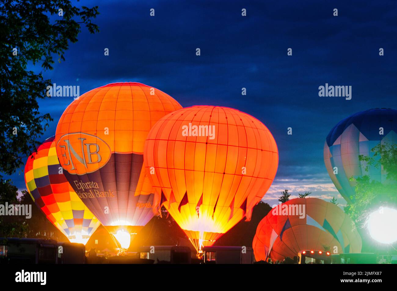 Multiple Hot Air Balloon Glow as Balloons Fire There Propane Tanks and Light Up the Balloons