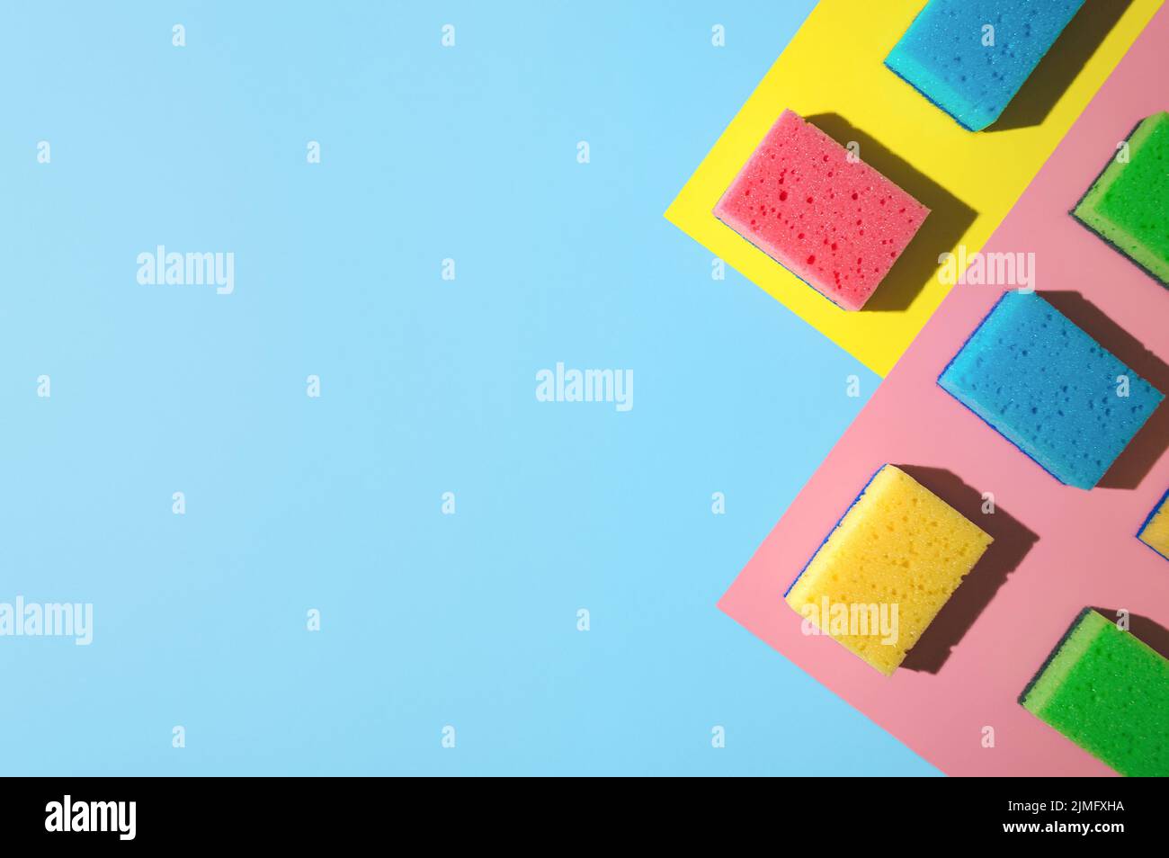 House cleaning sponges on blue background Stock Photo