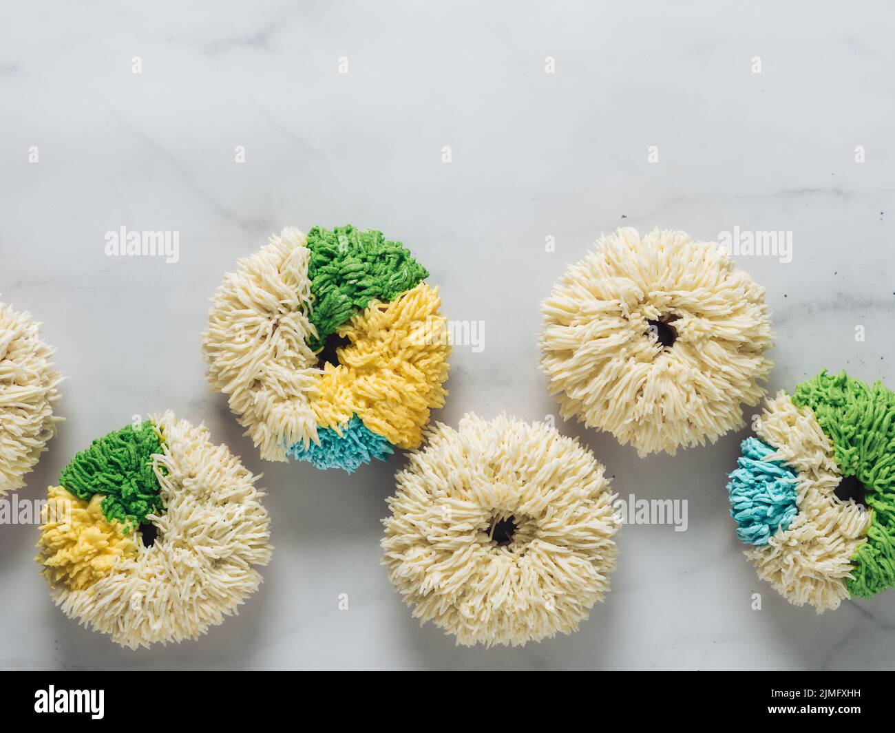 Shag donuts on marble background, copy space Stock Photo