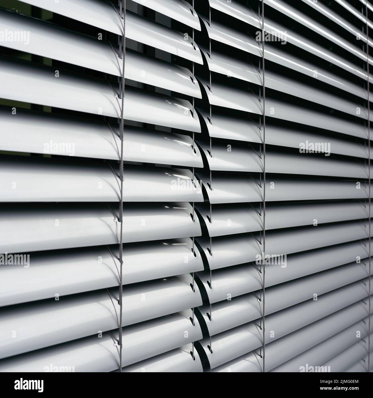 Blinds as sun protection on the window of an office building in Berlin in Germany Stock Photo