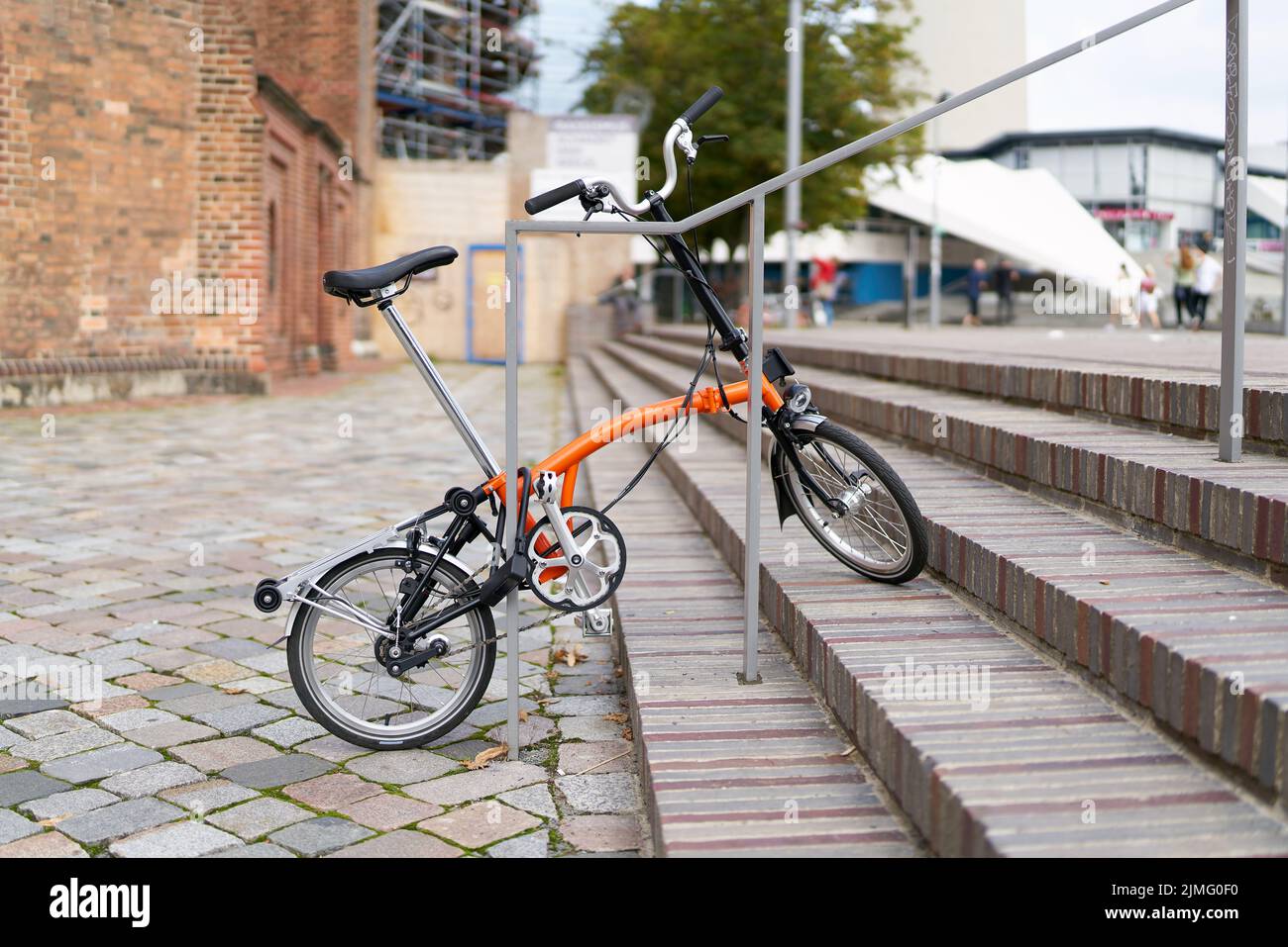 Bicycle on a stair railing in the center of Berlin Stock Photo