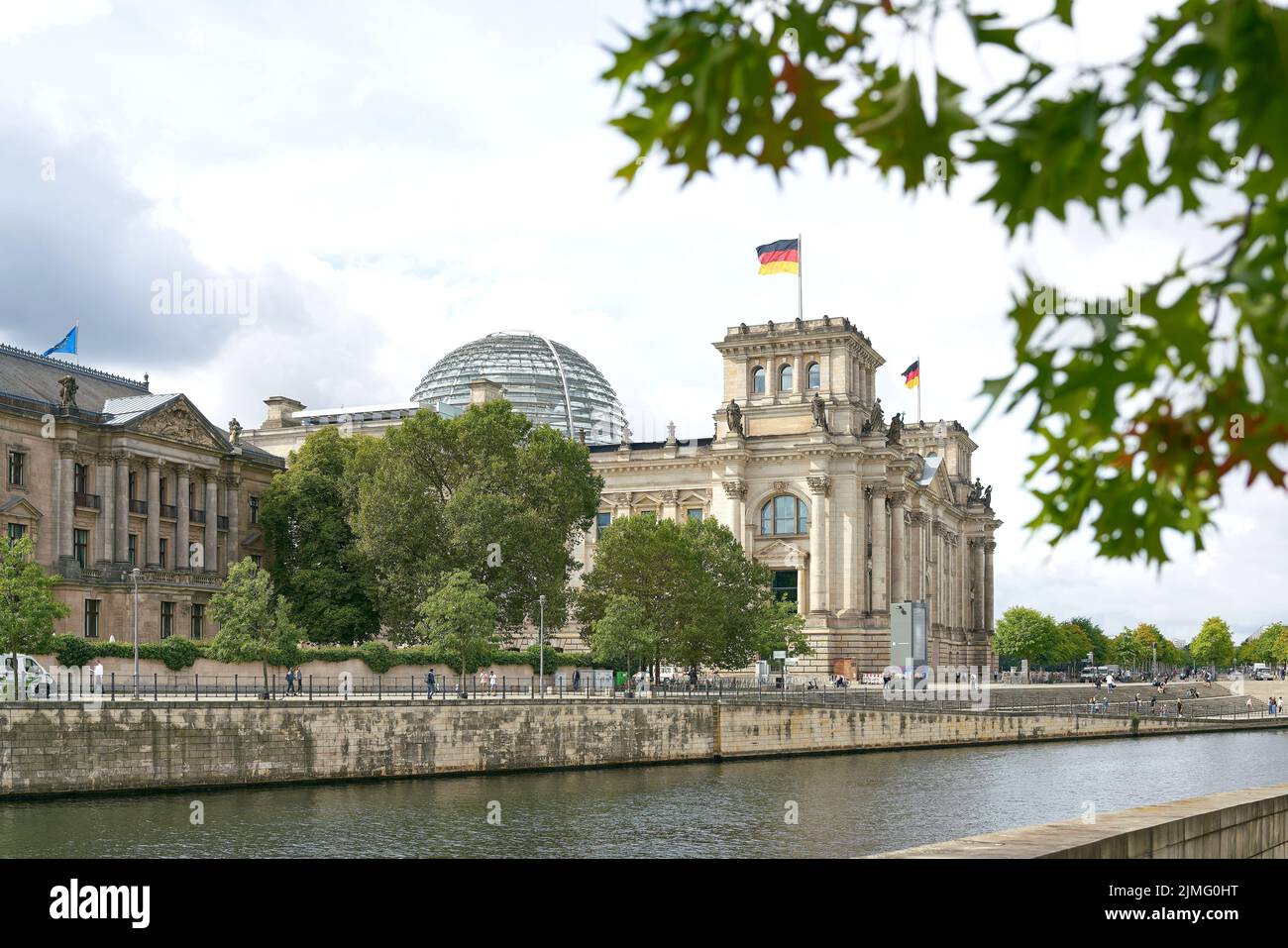 The Reichstag in Berlin on the banks of the Spree River Stock Photo