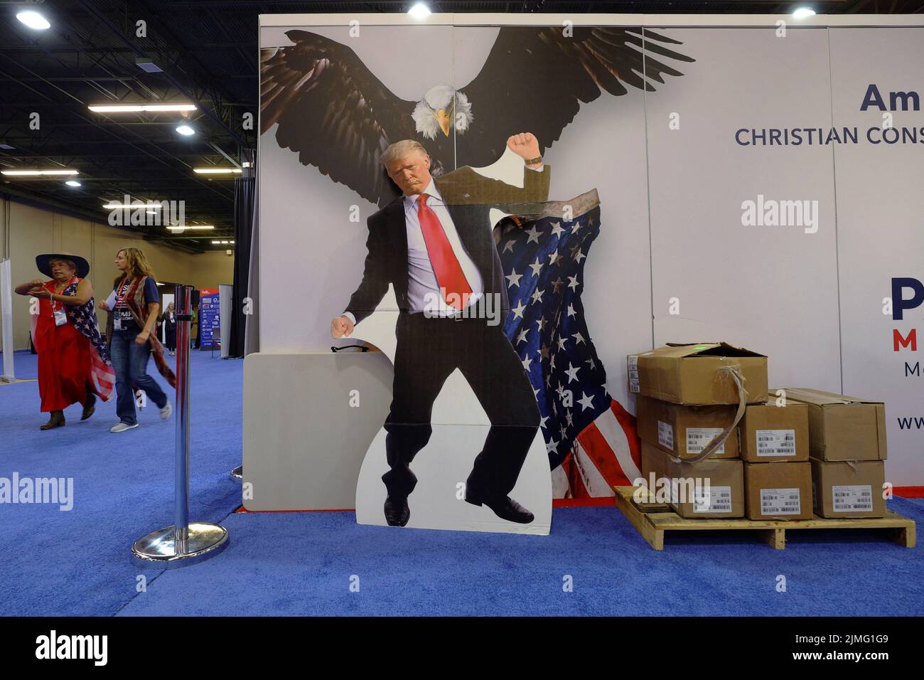 A cardboard cutout of former U.S. President Donald Trump stands behind an exhibit at the Conservative Political Action Conference (CPAC) in Dallas, Texas, U.S., August 6, 2022.  REUTERS/Brian Snyder Stock Photo