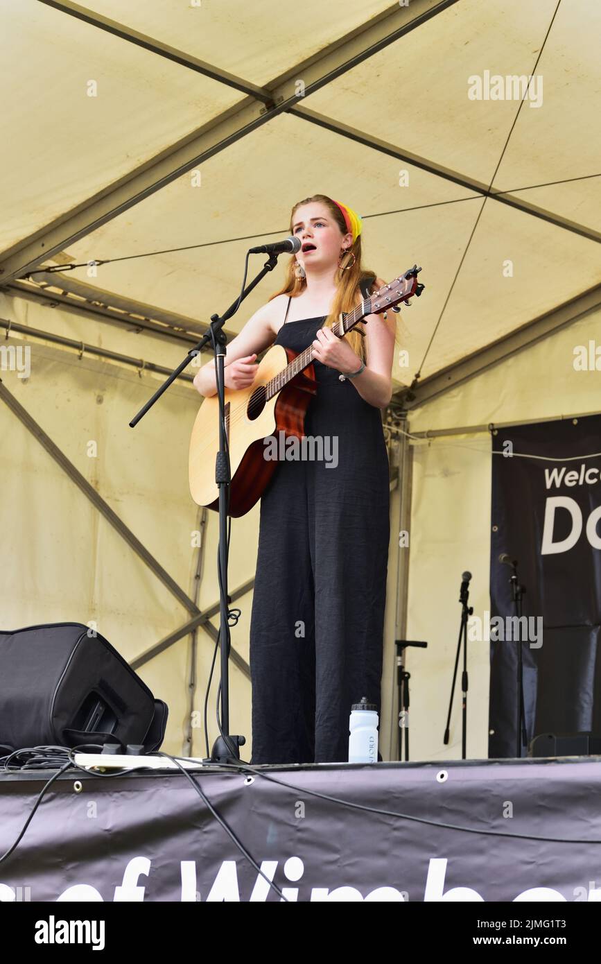 Local singer/songwriter Camilla B performing on the Willow Walk stage