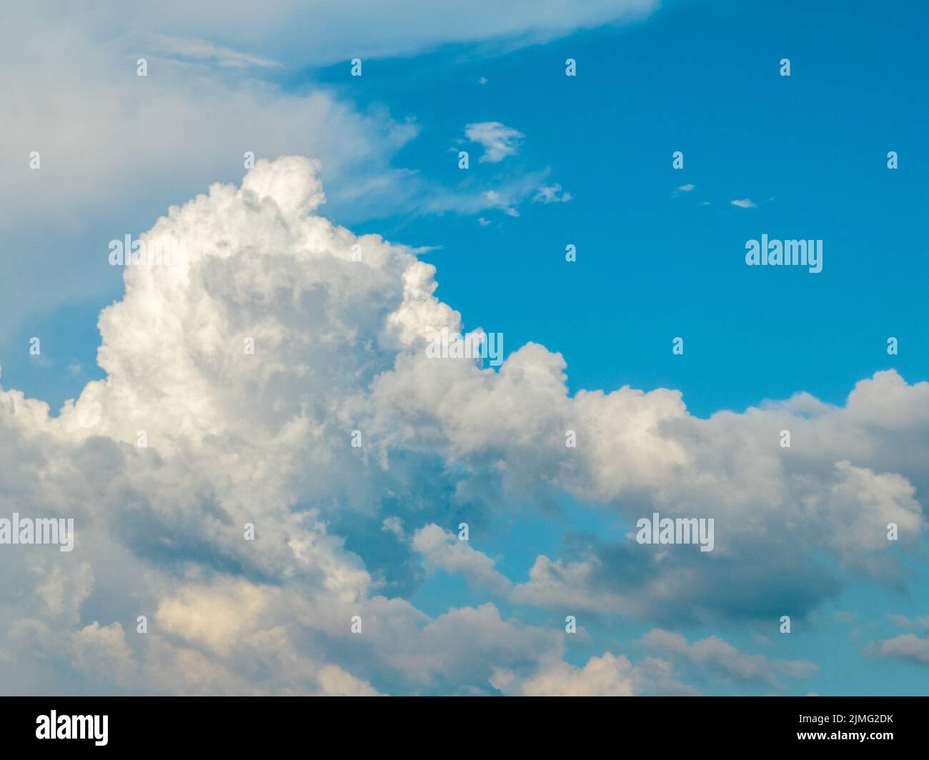 Beautiful billowing white cloud formation and clear blue sky Stock Photo