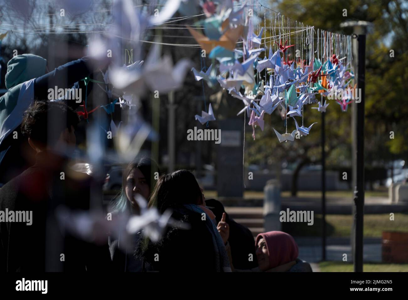 High school students of Firmat, hang a thousand origami cranes during 'A Day for Peace' event marking the 77th anniversary of the atomic bombing of Hiroshima by the USA. Stock Photo