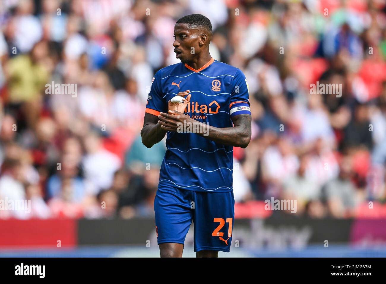 Marvin Ekpiteta #21 of Blackpool gives his team instructions Stock ...