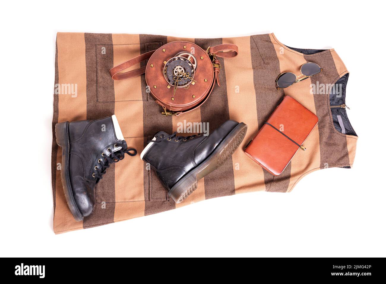 Fall dress and boots outfit flat lay. Trendy steampunk accessories. Stock Photo