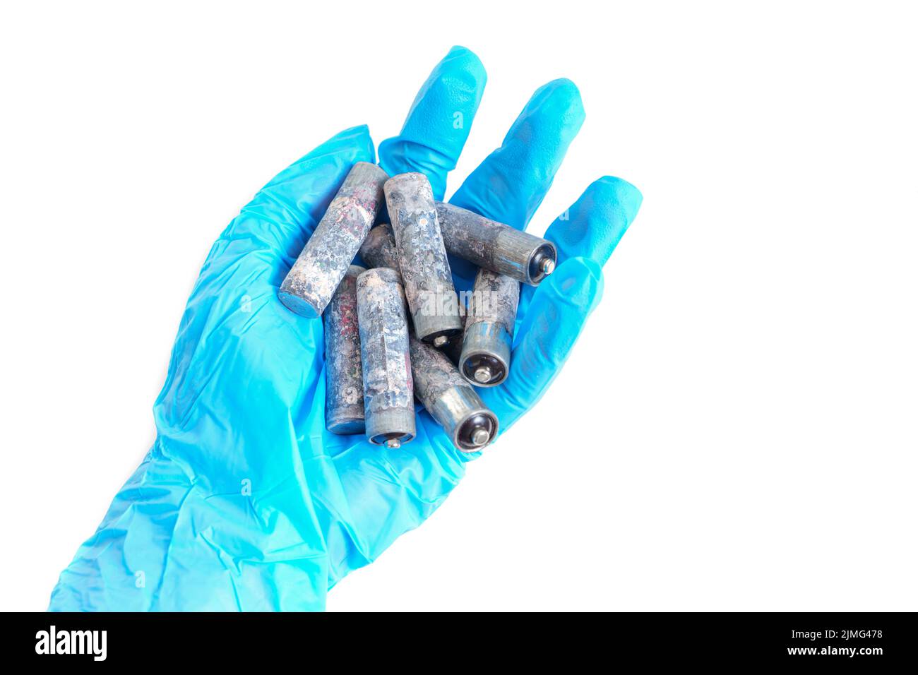 Bunch of heavily corroded AA type batteries isolated in hand isolated