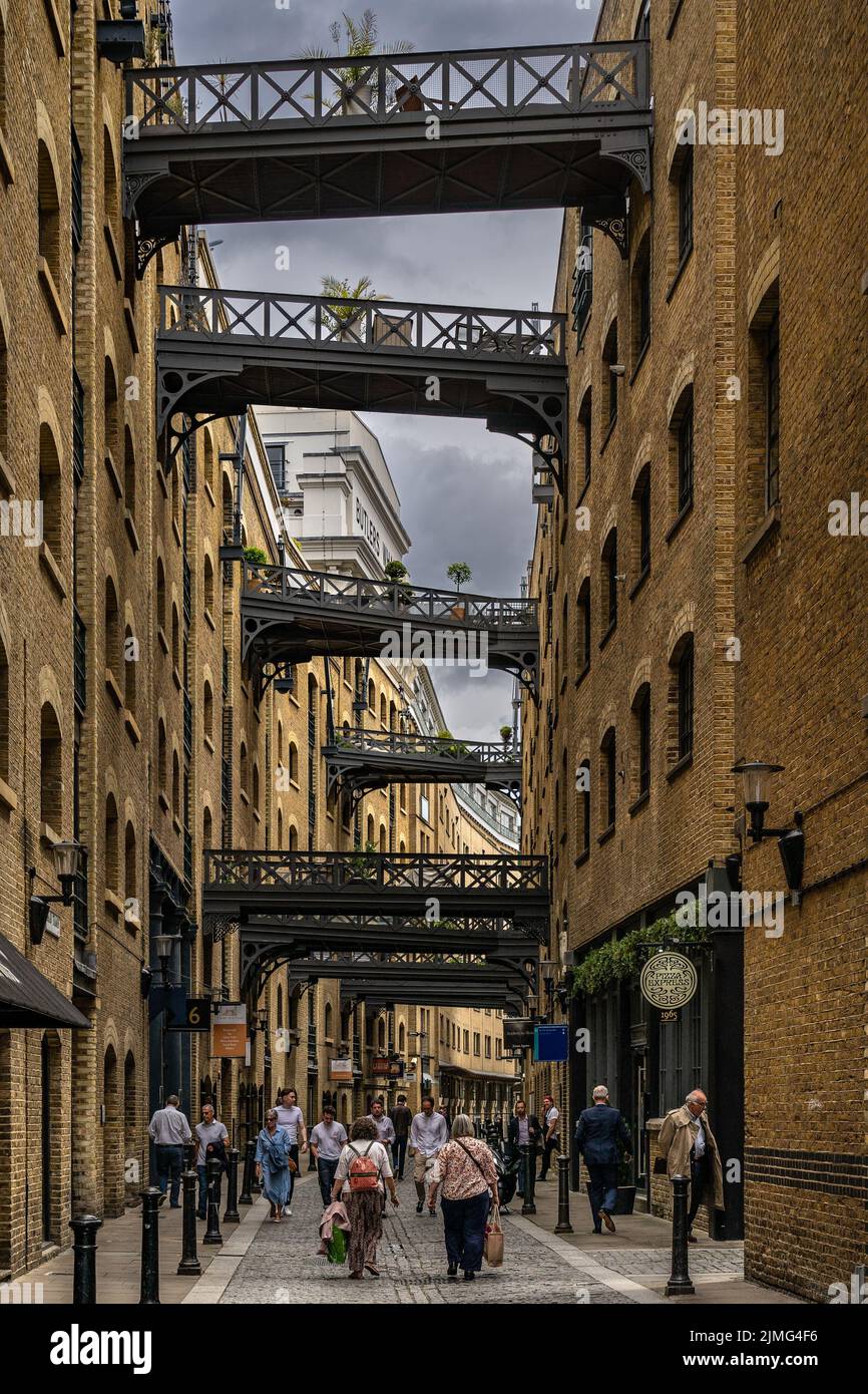 London, UK - Jun 09 2022: Shad Thames, one of the oldest streets of London next to Tower Bridge Stock Photo