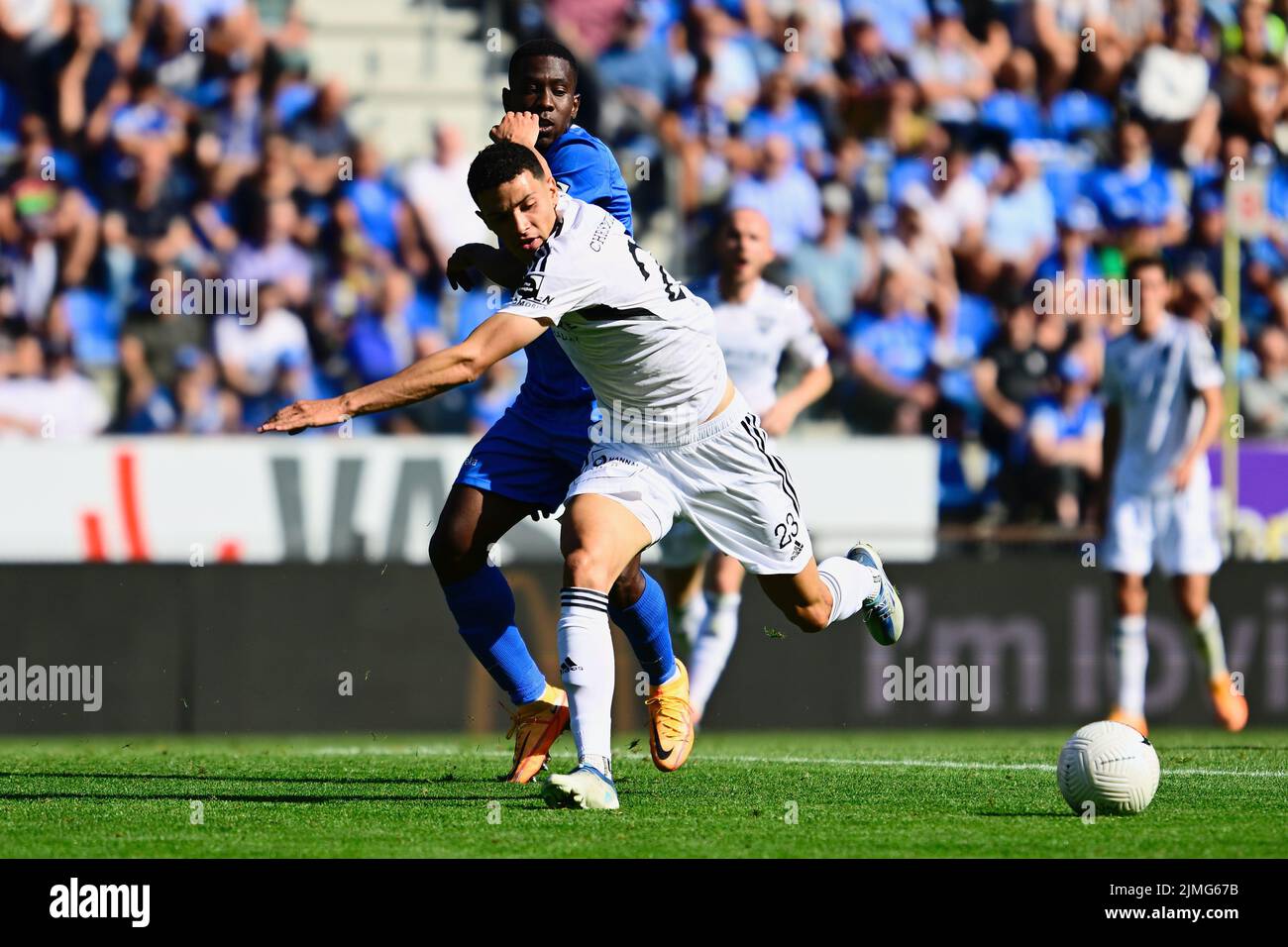Genk's Carlos Cuesta and Eupen's Isaac Christie-Davies fight for the ball during a soccer match between KRC Genk and KAS Eupen, Saturday 06 August 2022 in Genk, on day 3 of the 2022-2023 'Jupiler Pro League' first division of the Belgian championship. BELGA PHOTO JOHAN EYCKENS Stock Photo