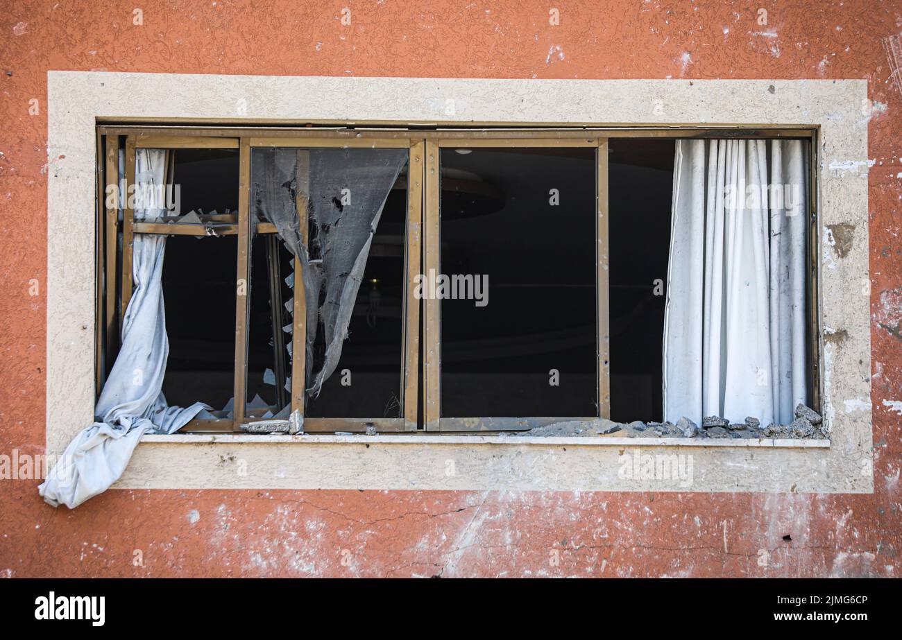 View of a damage window building caused by an Israeli air strike in Sheikh Acleyn neighborhood in Gaza. The Israeli military launched deadly strikes against what it said were Islamic Jihad targets in Gaza as tensions continue to rise between Israel and Palestinian militant groups. Stock Photo