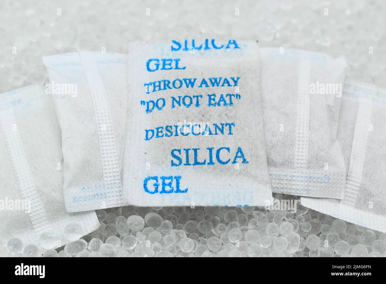 Sachet of new silica gel crystals. It is a desiccant. It adsorbs and