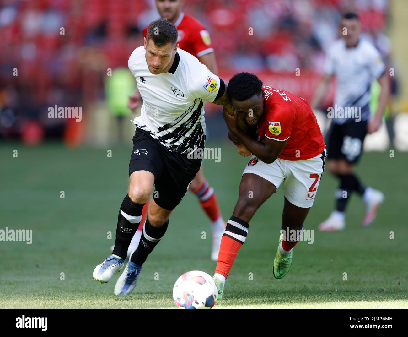 Derby County's James Collins (left) and Charlton Athletic's Steven Sessegnon battle for the ball during the Sky Bet League One match at The Valley, London. Picture date: Saturday August 6, 2022. Stock Photo
