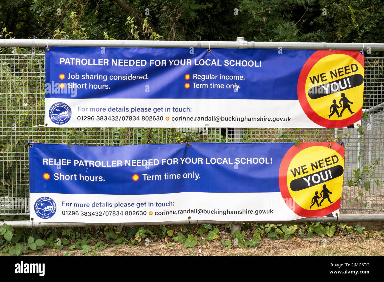 Roadside banners advertising for a Buckinghamshire school patroller and relief school patroller, also known as lollipop men and women, for a local school. There are currently around 60 patrollers in Buckinghamshire who assist children and adults to safely cross busy roads. Patrollers are sometimes verbally abused by motorists. A patroller needs to be in place for the start of Autumn term on September 5th 2022. Credit: Stephen Bell/Alamy Stock Photo