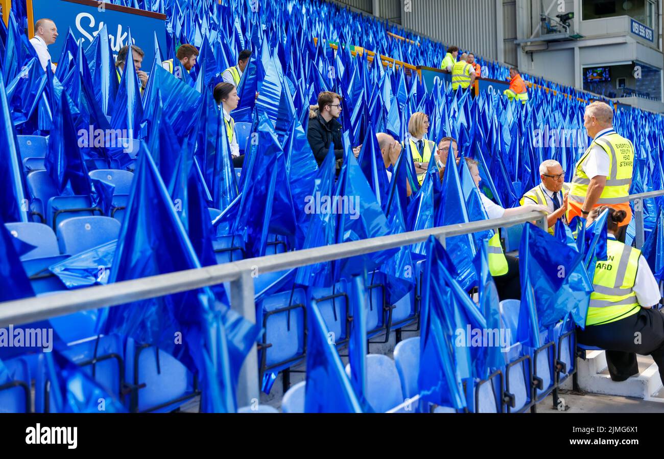 Goodison Park, Liverpool, UK. 6th Aug, 2022. Premier League football, Everton versus Chelsea: Stewards surrounded by blue flags at the Park End provided for fans prior to the match Credit: Action Plus Sports/Alamy Live News Stock Photo