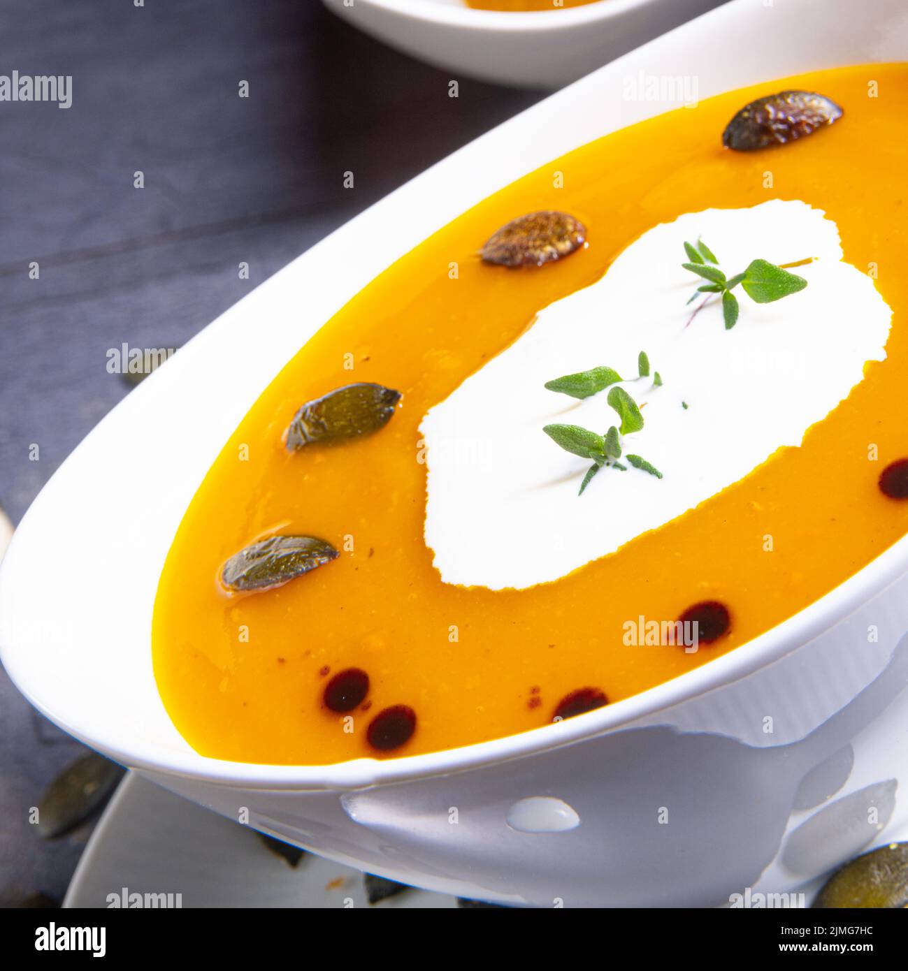 Delicious vegetable pumpkin cream soup with coconut milk Stock Photo