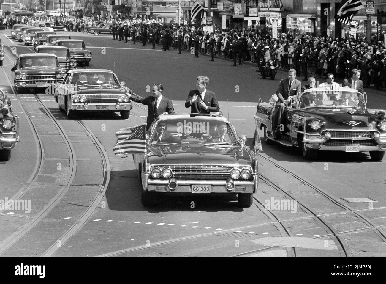 U.S. President John F. Kennedy with King Hassan II of Morocco standing in car, during Welcoming Parade, Washington, D.C., USA, Marion S. Trikosko, U.S. News & World Report Magazine Photograph Collection, March 27, 1963 Stock Photo