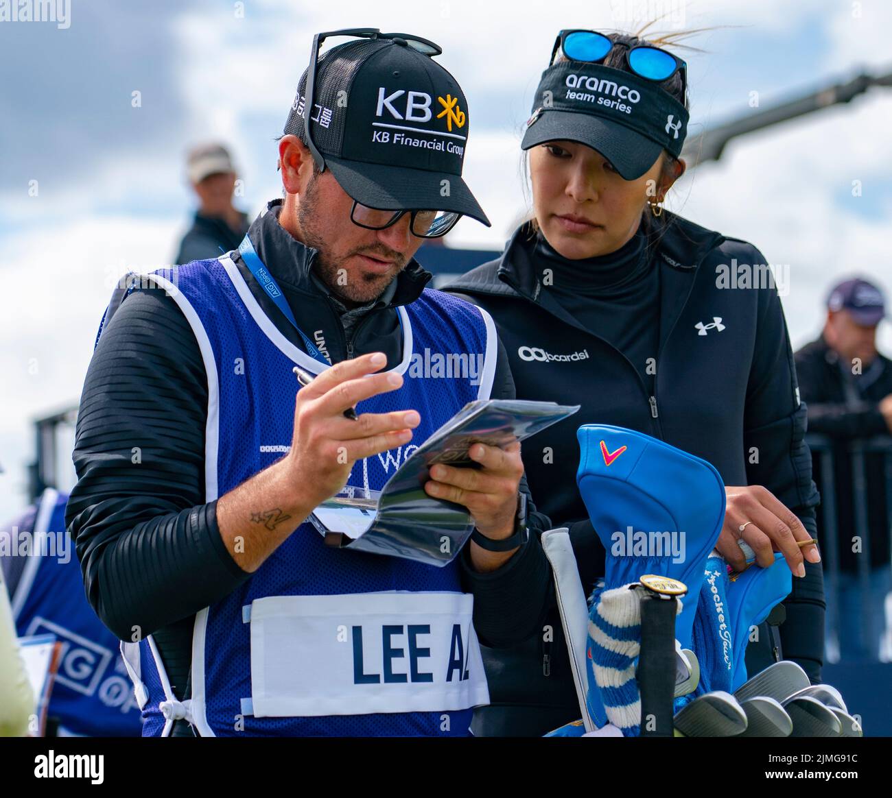 Gullane, Scotland, UK. 6th August 2022. Third round of the AIG Women’s Open golf championship at Muirfield in East Lothian. Pic; Alison Lee talks with caddie at the 13th hole.  Iain Masterton/Alamy Live News Stock Photo