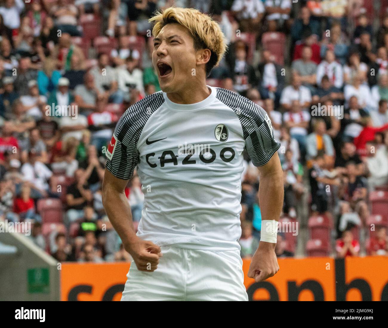 Augsburg, Germany. 06th Aug, 2022. Soccer, Bundesliga, FC Augsburg - SC Freiburg, Matchday 1, WWK-Arena. Freiburg's Ritsu Doan celebrates after his goal for 0:4. Credit: Stefan Puchner/dpa - IMPORTANT NOTE: In accordance with the requirements of the DFL Deutsche Fußball Liga and the DFB Deutscher Fußball-Bund, it is prohibited to use or have used photographs taken in the stadium and/or of the match in the form of sequence pictures and/or video-like photo series./dpa/Alamy Live News Stock Photo