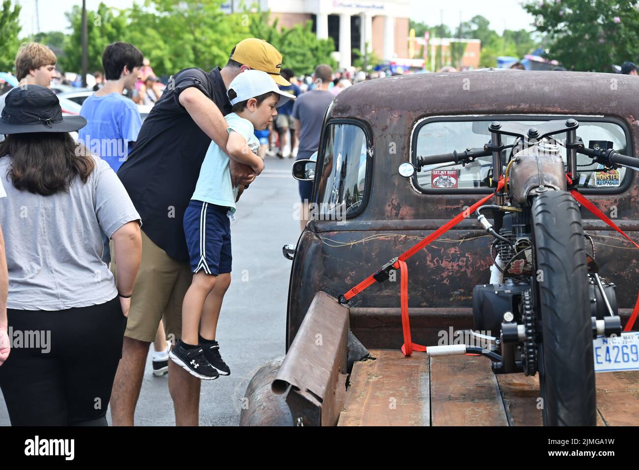 Durham, NC, USA, 6th August 2022, Car enthusiasts gather to see the exotic and classic cars at the monthly Cars and Coffee event. Credit D Guest Smith / Alamy Live News Stock Photo