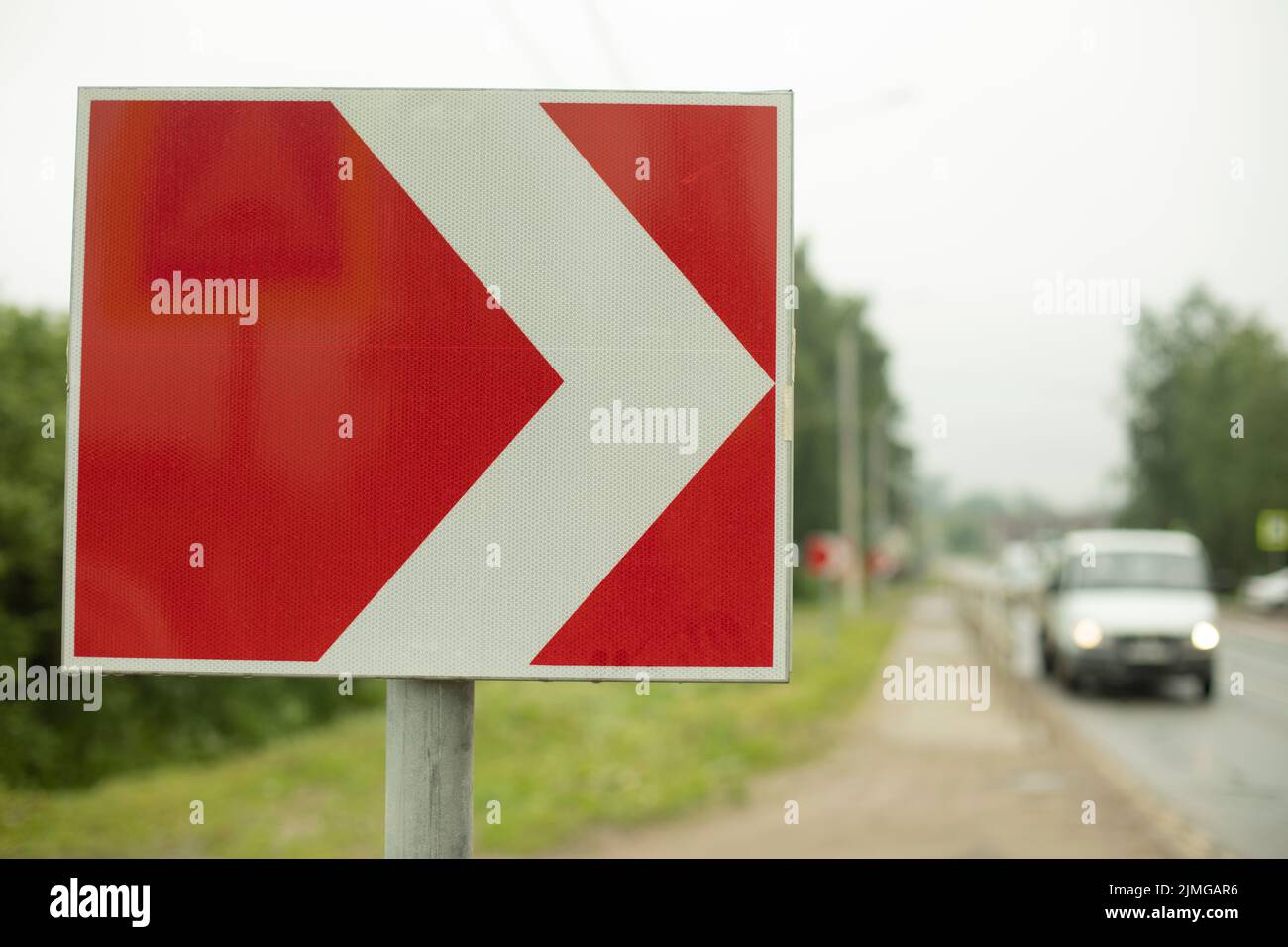 Sharp turn sign on road. Place of sharp bend in road. Stock Photo