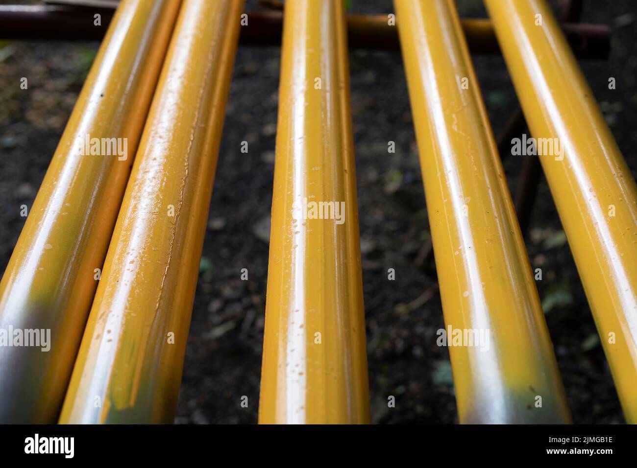 Yellow pipes. Gas pipes lie in row. Preparation of equipment