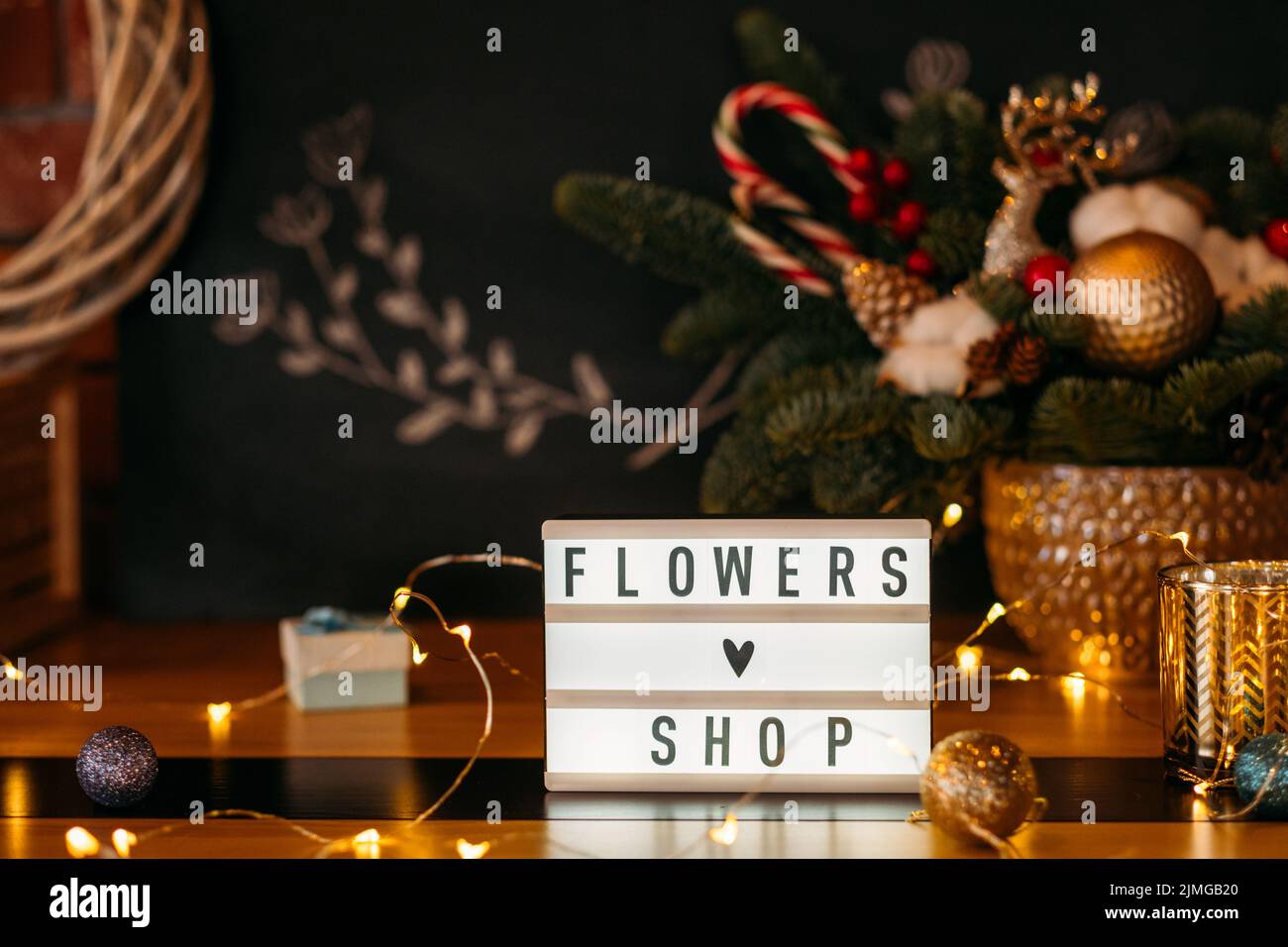 florist workplace flowers shop sign plate lights Stock Photo