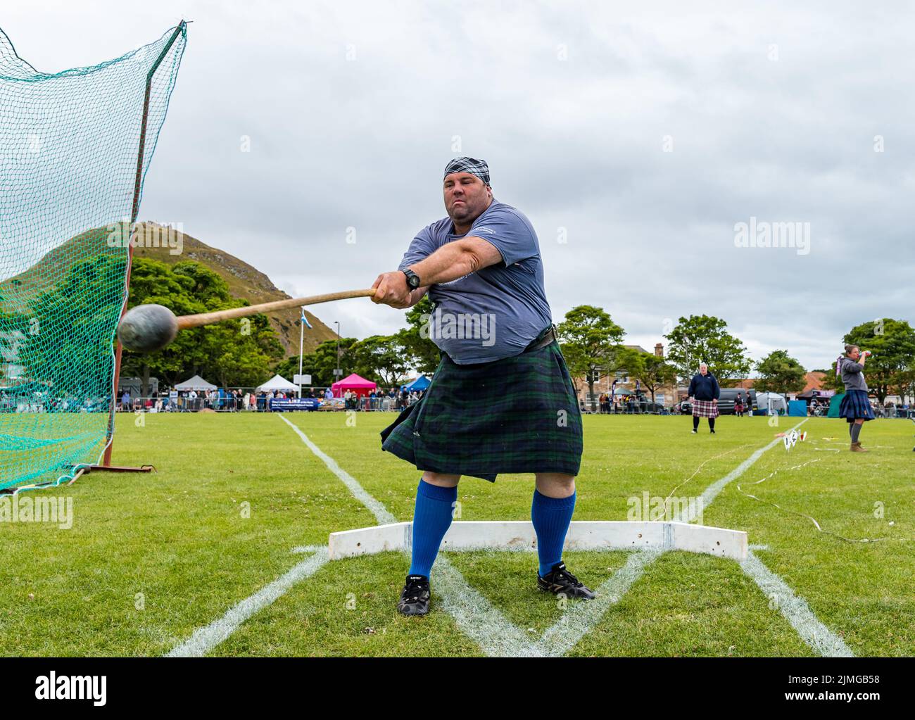 North Berwick, East Lothian, Scotland, United Kingdom, 6th August 2022. North Berwick Highland games: the annual games takes place at the recreation ground in the seaside town. Pictured: Peter Hart, a farmer from Perthshire tosses a hammer. Credit: Sally Anderson/Alamy Live News Stock Photo