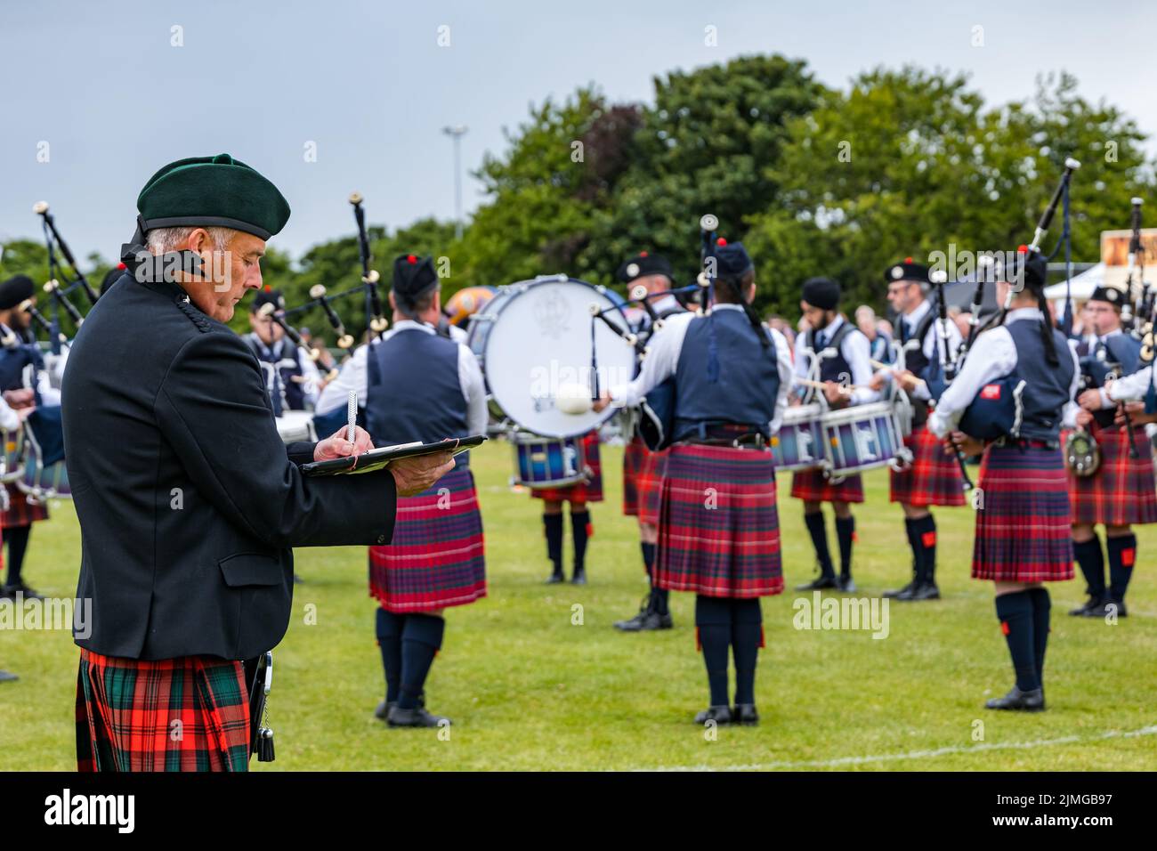 North Berwick, East Lothian, Scotland, United Kingdom, 6th August 2022. North Berwick Highland games: the annual games takes place at the recreation ground in the seaside town. Pictured: the Highland Pipe Band judging. Credit: Sally Anderson/Alamy Live News Stock Photo