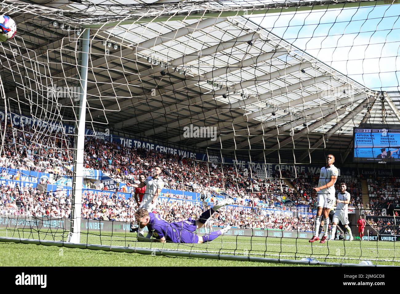 Swansea, UK. 06th Aug, 2022. Lewis Travis of Blackburn Rovers (l) beats Swansea city goalkeeper Andy Fisher as he scores his teams 3rd goal. EFL Skybet championship match, Swansea city v Blackburn Rovers at the Swansea.com Stadium in Swansea, Wales on Saturday 6th August 2022. this image may only be used for Editorial purposes. Editorial use only, license required for commercial use. No use in betting, games or a single club/league/player publications. pic by Andrew Orchard/Andrew Orchard sports photography/Alamy Live news Credit: Andrew Orchard sports photography/Alamy Live News Stock Photo