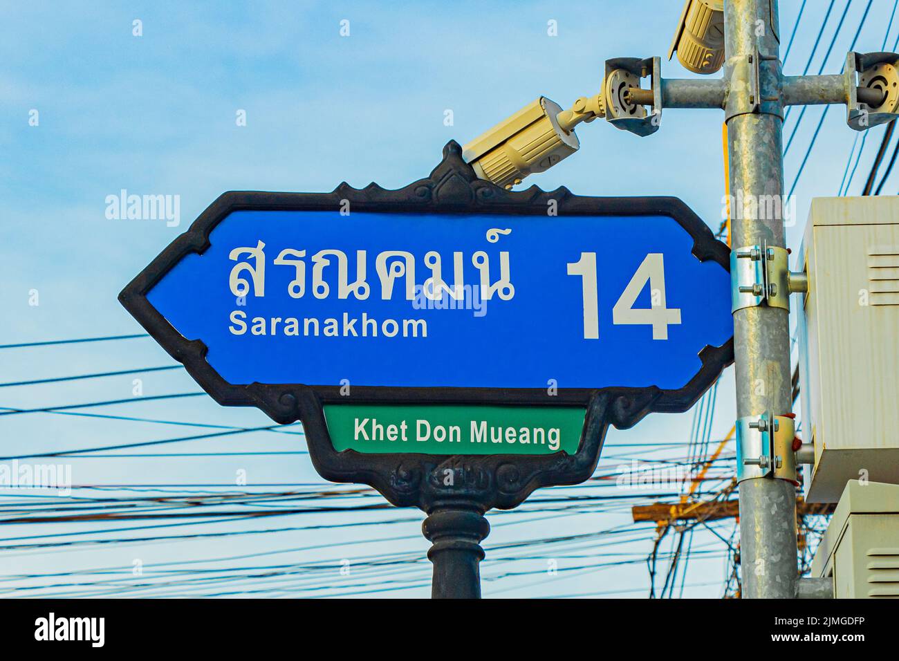 Typical blue Asian style road sign in Bangkok Thailand. Stock Photo